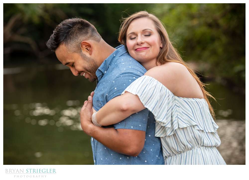 hugging fiance in photos